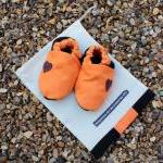 Baby booties, orange and bl..