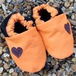 Baby booties, orange and bl..