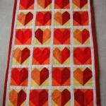 Baby cot quilt - red hearts
