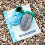 Baby booties, blue and whit..