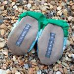Baby booties, blue and whit..