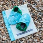 Baby booties, blue and whit..