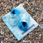 Baby booties, blue flowers ..