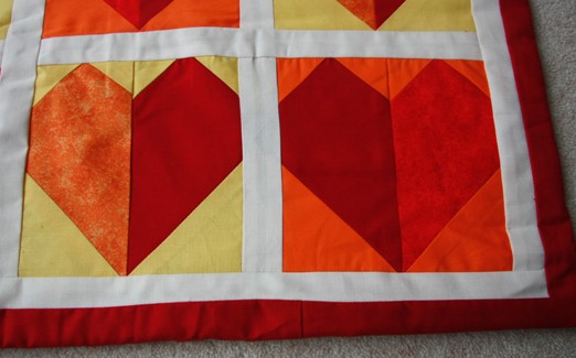 Baby cot quilt - red hearts