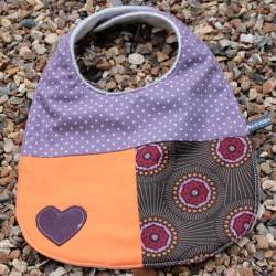 Baby bib - purple, orange bursts